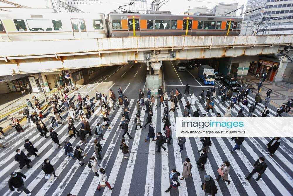 Day after Japan expands coronavirus emergency to 7 more prefectures People wearing face masks walk in Osaka s Umeda area on Jan. 14, 2021. Prime Minister Yoshihide Suga declared a state of emergency in seven additional prefectures, including Osaka, the previous day amid the continued spread of the novel coronavirus.