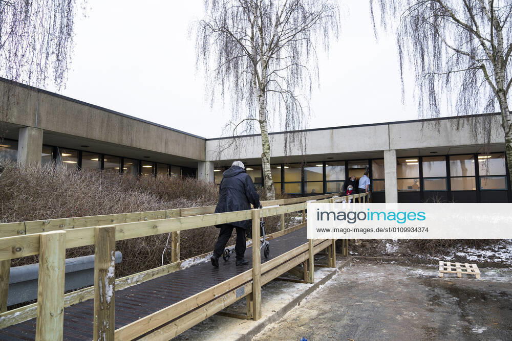 First citizen in Denmark is vaccinated with covid 19 vaccine from Moderna in the vaccination center in Vejle Thursday 14 January 2021 Here is an elderly woman with a walker on her way in, while another woman in a wheelchair is on her way out of the vaccination center, Vejle Denmark