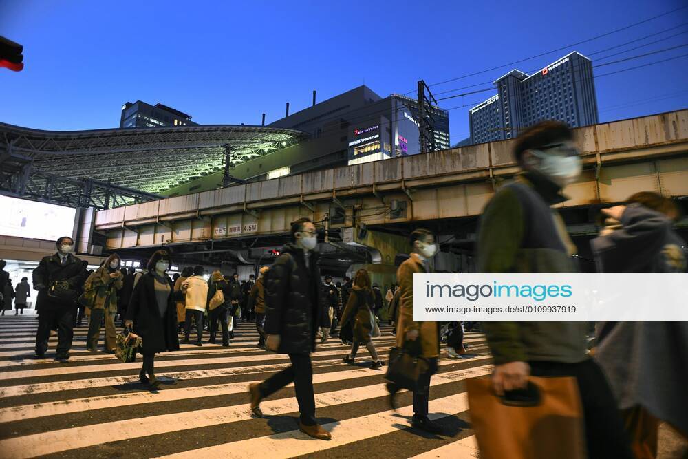 Day after Japan expands coronavirus emergency to 7 more prefectures People wearing face masks walk in Osaka s Umeda area on Jan. 14, 2021, a day after Japanese Prime Minister Yoshihide Suga declared a state of emergency in seven additional prefectures, including Osaka, amid the continued spread of the novel coronavirus.