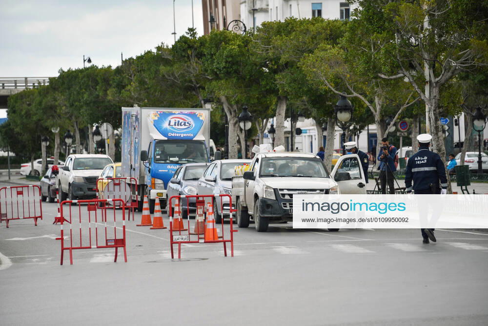 A police roadblock to control citizens is pictured on the Tunis-la Marsa highway deserted amid of a lockdown due to the Covid-19 pandemic as the country marks 10 years since its revolution. Tunisia marked 10 years today since its street revolution sent autocratic ruler Zine El Abidine Ben Ali fleeing into exile, but few are celebrating amid a lockdown as Covid-19 cases spiral. Tunis Tunisia - ZUMAs197 20210114_zaa_s197_114