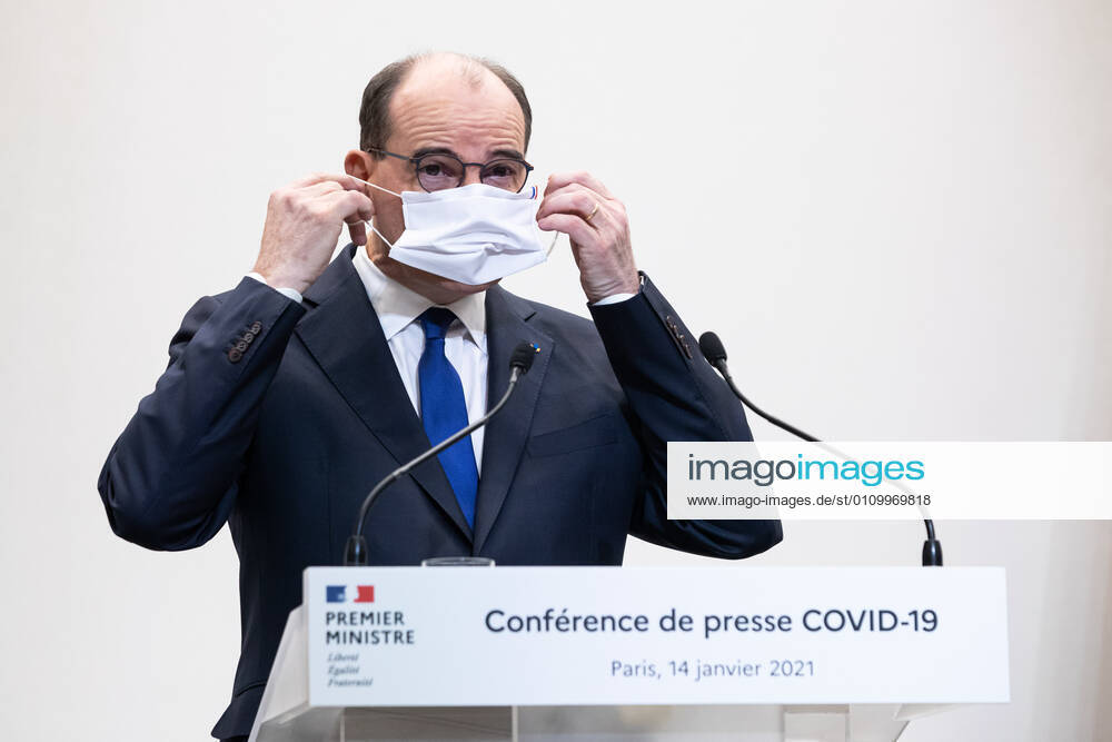 - French Prime Minister Jean Castex puts on his mask as he addresses a press conference on the current French government strategy for the ongoing coronavirus (Covid-19) epidemic.