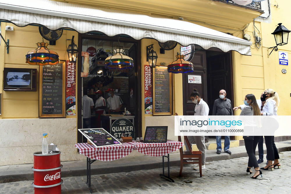 (210115) -- HAVANA, Jan. 15, 2021 -- People wearing face masks wait outside a restaurant in Havana, Cuba, Jan. 14, 2021. Local government in Havana announced new restrictive measures in response to the COVID-19 pandemic as 550 new cases were logged nationwide on Wednesday, setting a new daily record for the sixth day in a row. (Photo by Xinhua) CUBA-HAVANA-COVID-19-CASES JoaquinxHernandez