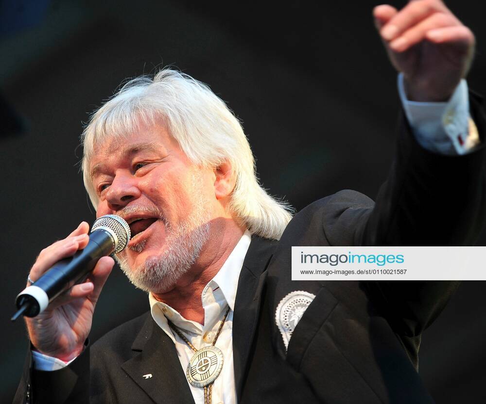 Peter Petrel singer 08 10 wow Peter Petrel on 21 August 2010 at the 3 NRW Schlagerparade in Harsewinkel Germany german german man music schlager singer schlager party concert stage live open air german singer cross portrait singing gesticulating
