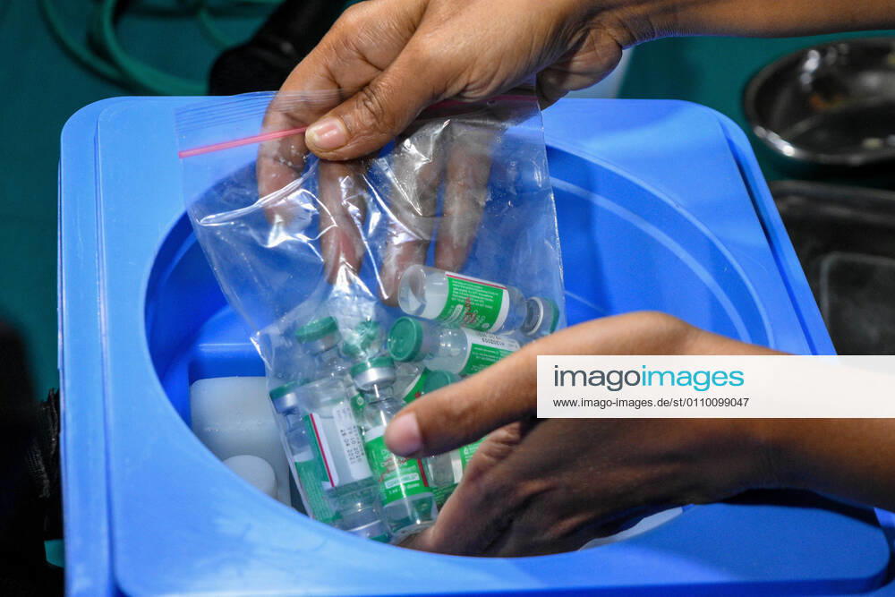 Sisters taking out COVISHIEALD vaccine from cold storage.With urgent effect , COVID vaccination drives starts in India from 16th of January 2021.The vaccination progrmae are allotted exclusive to the frontline health workers in its first phase of vaccine drive. As of now, COVISHIELD and COVAXIN has been approved by Indian government for use for vaccination. Kolkata India - ZUMAc211 20210116_zip_c211_005