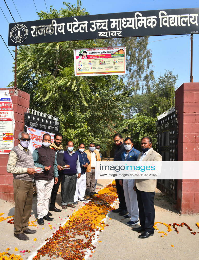 India: Teachers welcome students after schools reopen in Rajasthan Teachers wearing face mask waits to students for welcome at a government school that was reopened after remaining closed for 309 days due to COVID-19 pandemic in Beawar. Beawar Rajasthan India