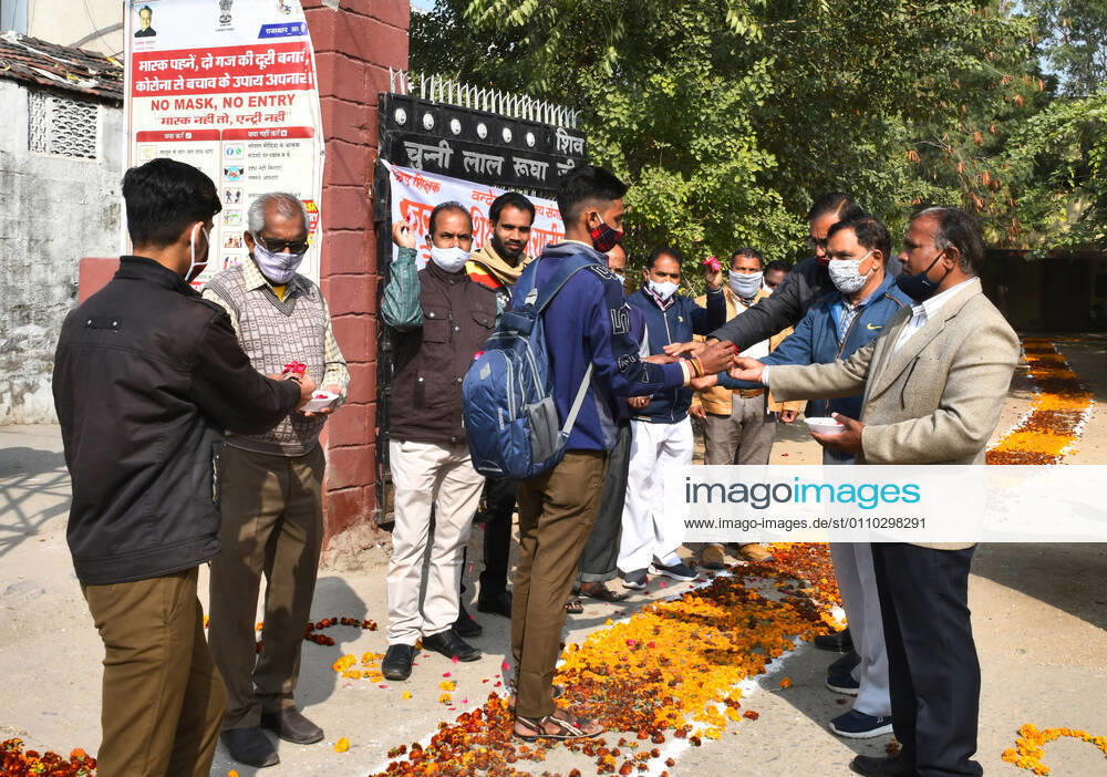 India: Teachers welcome students after schools reopen in Rajasthan Students greeted by teachers as they arrive to attend classes at a government school that was reopened after remaining closed for 309 days due to COVID-19 pandemic in Beawar. Beawar Rajasthan India