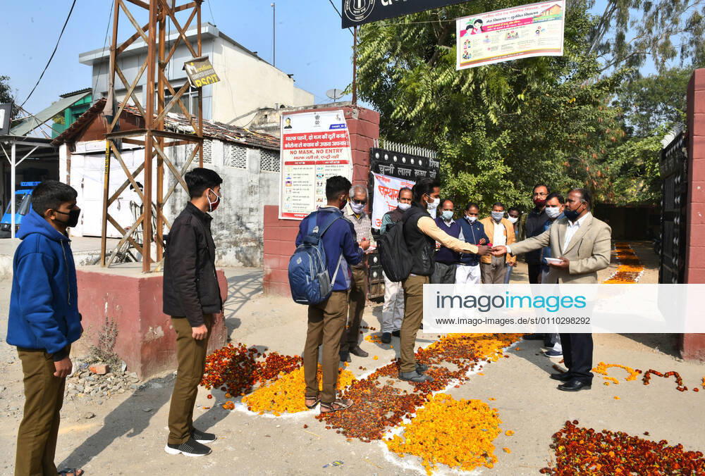 India: Teachers welcome students after schools reopen in Rajasthan Students greeted by teachers as they arrive to attend classes at a government school that was reopened after remaining closed for 309 days due to COVID-19 pandemic in Beawar. Beawar Rajasthan India