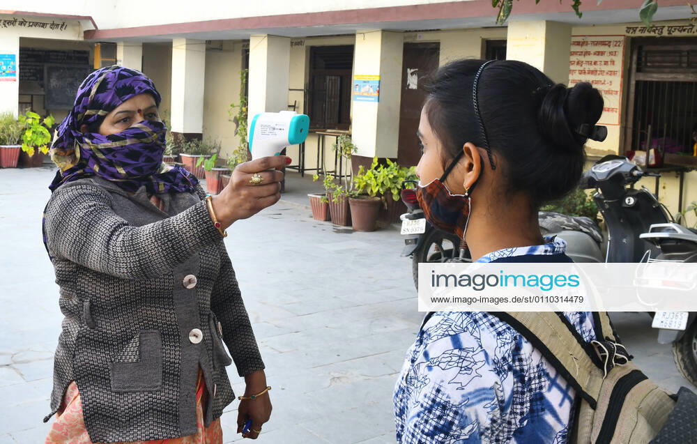 India: Schools reopened after 10 months in Rajasthan Student undergo thermal screening as she arrive to attend class at a government school that was reopened after remaining closed for 309 days due to COVID-19 pandemic in Beawar. Beawar Rajasthan India