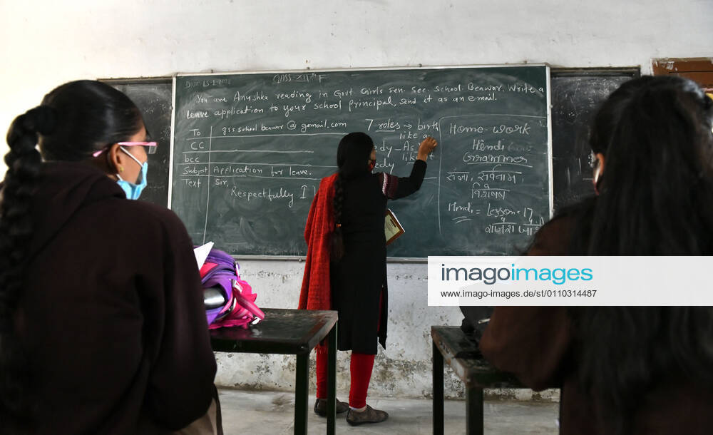India: Schools reopened after 10 months in Rajasthan A teacher wearing face mask takes the class of students at a government school that was reopened after remaining closed for 309 days due to COVID-19 pandemic in Beawar. Beawar Rajasthan India