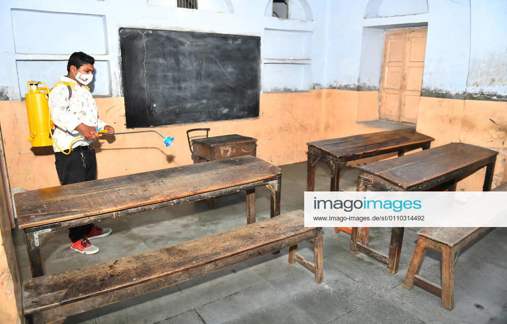 India: Schools reopened after 10 months in Rajasthan Worker sanitise a classroom at a school that was reopened after remaining closed for 309 days due to COVID-19 pandemic in Beawar. Beawar Rajasthan India