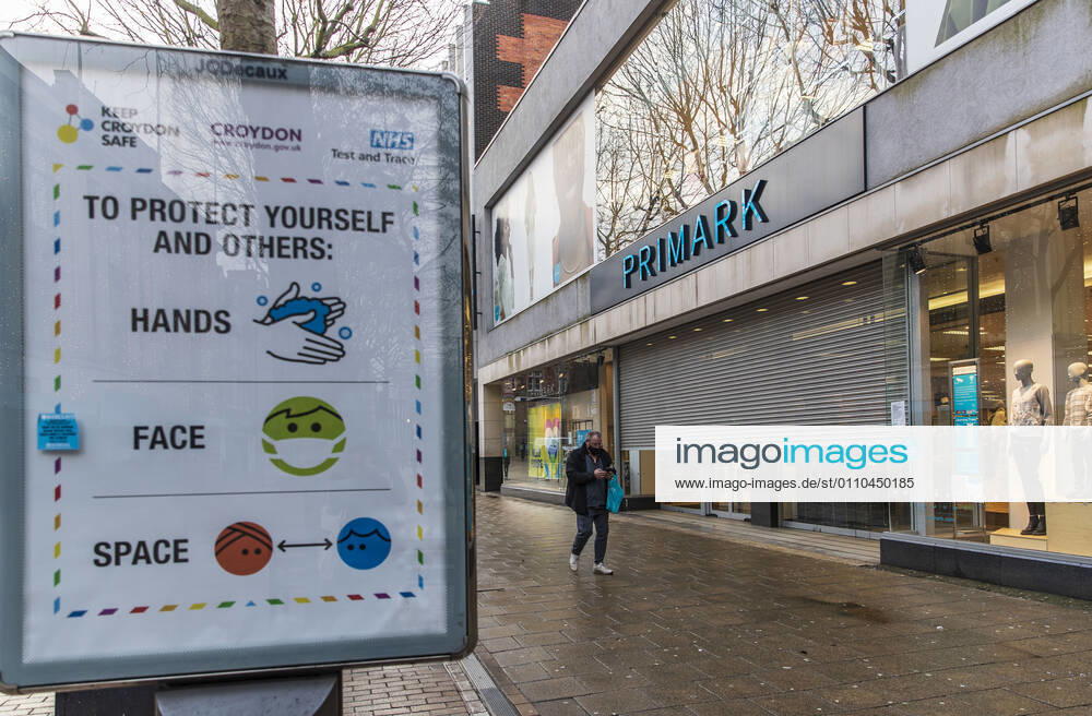 A man wearing a face mask walks past a closed Primark fashion shop in Croydon..Only 33,355 positive Covid19 cases have been recorded today, the lowest number of daily cases since December 27th- before the start of Englands third nationwide lockdown. London United Kingdom - ZUMAs197 20210119_zab_s197_018