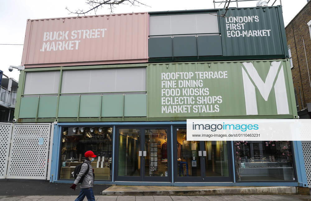 (210120) -- LONDON, Jan. 20, 2021 -- A woman wearing a face mask walks past the closed Buck Street Market in London, Britain, on Jan. 19, 2021. The number of people who have died within 28 days of a positive coronavirus test has surpassed the grim milestone of 90,000 in Britain after another 1,610 were confirmed, according to official figures released Tuesday. The latest daily death toll, the highest since the pandemic began in the country, brought the total number of coronavirus-related deaths in Britain to 91,470, the data showed. ) BRITAIN-LONDON-COVID-19-DEATH TOLL HanxYan