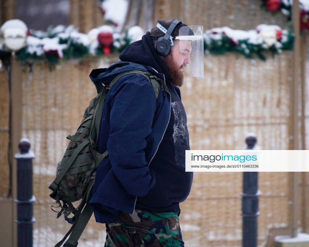 (210120) -- WARSAW, Jan. 20, 2021 -- A man wearing a plastic face shield is seen in Warsaw, Poland, on Jan. 19, 2021. (Photo by Xinhua) POLAND-WARSAW-DAILY LIFE JaapxArriens