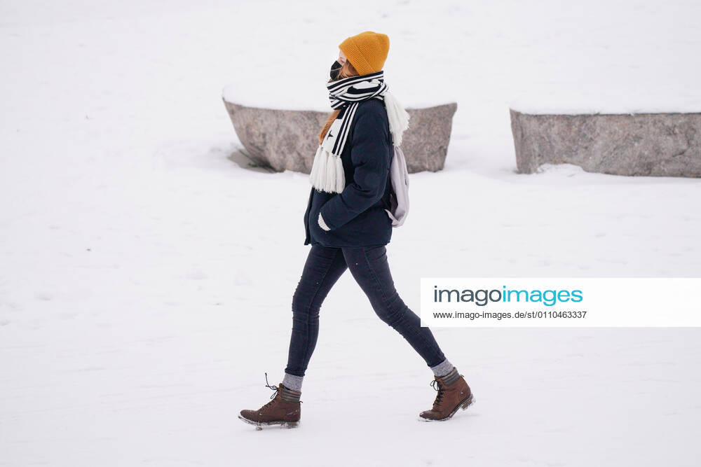 (210120) -- WARSAW, Jan. 20, 2021 -- A woman with a face mask walks on a snow-covered boulevard along the Vistula river in Warsaw, Poland, on Jan. 19, 2021. (Photo by Xinhua) POLAND-WARSAW-DAILY LIFE JaapxArriens