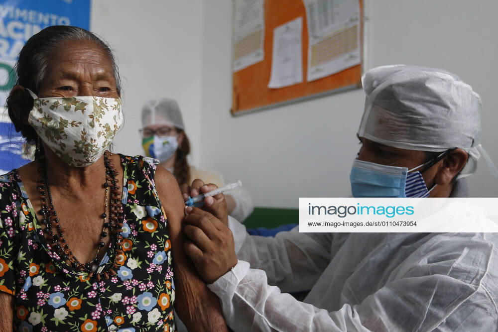 (210120) -- AMAZONAS, Jan. 20, 2021 -- A woman receives a dose of China s COVID-19 vaccine in the city of Tabatinga in the state of Amazonas, Brazil, Jan. 19, 2021. Brazil launched a mass immunization campaign against the COVID-19 pandemic in every state starting at 5:00 p.m. Monday local time (2000 GMT). As of Monday afternoon, all states were expected to have received their doses of the CoronaVac vaccine developed by Chinese laboratory Sinovac in collaboration with the Butantan Institute of Sao Paulo, one of the world s leading scientific research centers. (Photo by Xinhua) BRAZIL-AMAZONAS-COVID-19-VACCINE-MASS INOCULATION LucioxTavora
