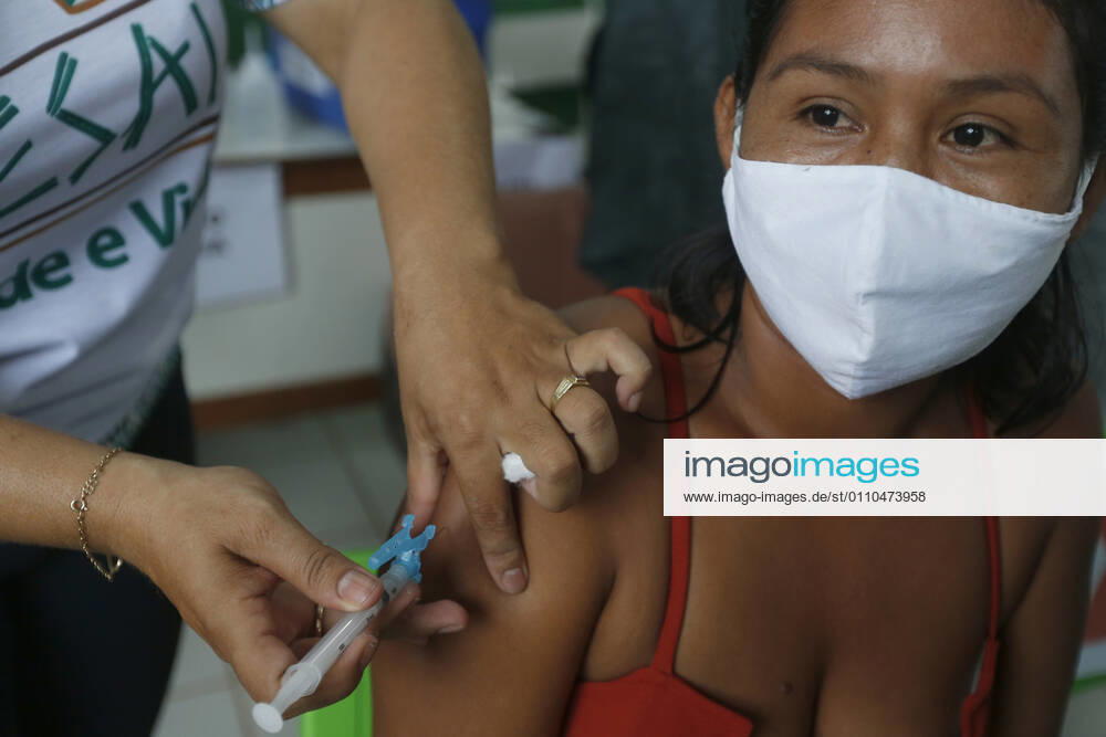 (210120) -- AMAZONAS, Jan. 20, 2021 -- A woman receives a dose of China s COVID-19 vaccine in the city of Tabatinga in the state of Amazonas, Brazil, Jan. 19, 2021. Brazil launched a mass immunization campaign against the COVID-19 pandemic in every state starting at 5:00 p.m. Monday local time (2000 GMT). As of Monday afternoon, all states were expected to have received their doses of the CoronaVac vaccine developed by Chinese laboratory Sinovac in collaboration with the Butantan Institute of Sao Paulo, one of the world s leading scientific research centers. (Photo by Xinhua) BRAZIL-AMAZONAS-COVID-19-VACCINE-MASS INOCULATION LucioxTavora