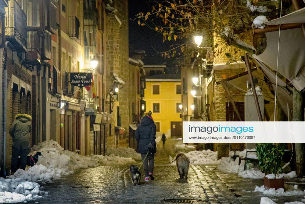 A woman walks with her two dogs in a street in Toledo, Castilla-La Mancha (Spain), on January 19, 2021. At midnight today, the new measures of the regional government to combat the coronavirus came into force in Castilla-La Mancha. The most relevant restrictions include the advance of the curfew to 22.00, the closure of all municipalities and the closure of hotels, shopping centres and leisure places in general. 19 JANUARY 2021 Mario Trivino LagenciaEP 01 19 2021 Toledo (Castilla-La Mancha ) Toledo (Castilla-La Mancha ) Spain