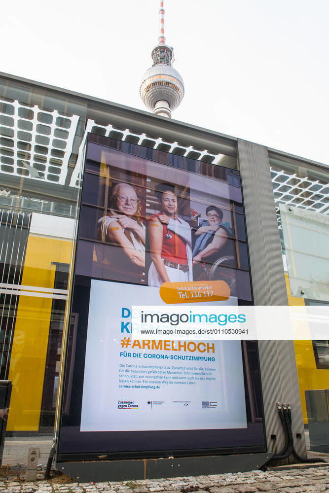 Health Corona Virus Vaccination Campaign Advertisement of the Federal Ministry of Health, the Robert Koch Institute and the Federal Centre for Health Education for the Corona vaccination on a digital billboard at Alexanderplatz 20 1 2021, Berlin, Germany