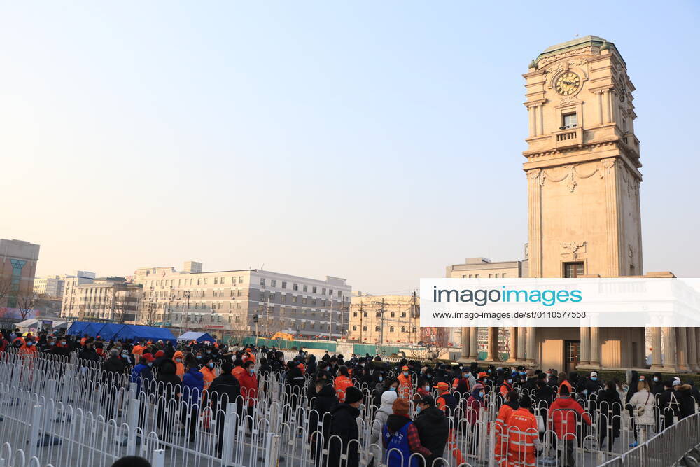 Local residents queue up for nucleic acid testing at a square in Xicheng district on January 20, 2021 in Beijing, China.