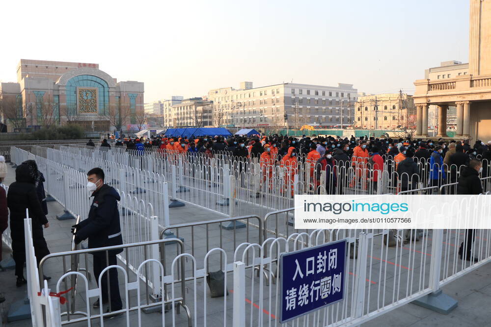 Local residents queue up for nucleic acid testing at a square in Xicheng district on January 20, 2021 in Beijing, China.
