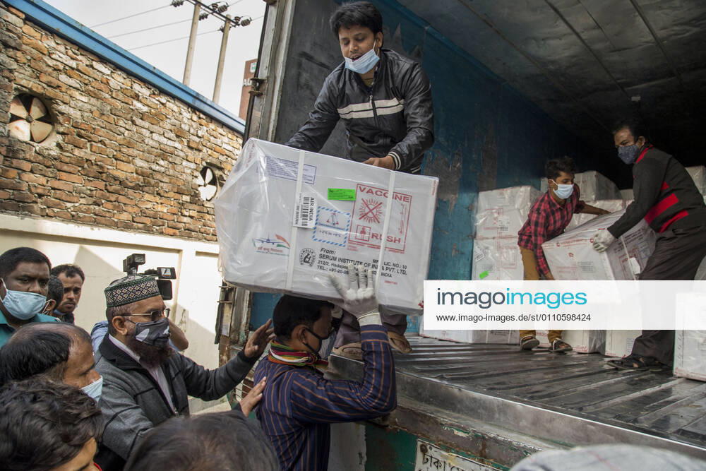 Workers unload a covered van that carries Oxford-AstraZeneca COVID-19 vaccines which arrived from India to Bangladesh as a gift. Dhaka Bangladesh - ZUMAr331 20210121_zip_r331_010