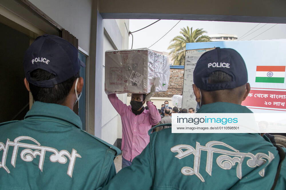 A worker carries a carton of Oxford-AstraZeneca COVID-19 vaccines that arrived from India to Bangladesh as a gift. Dhaka Bangladesh - ZUMAr331 20210121_zip_r331_016