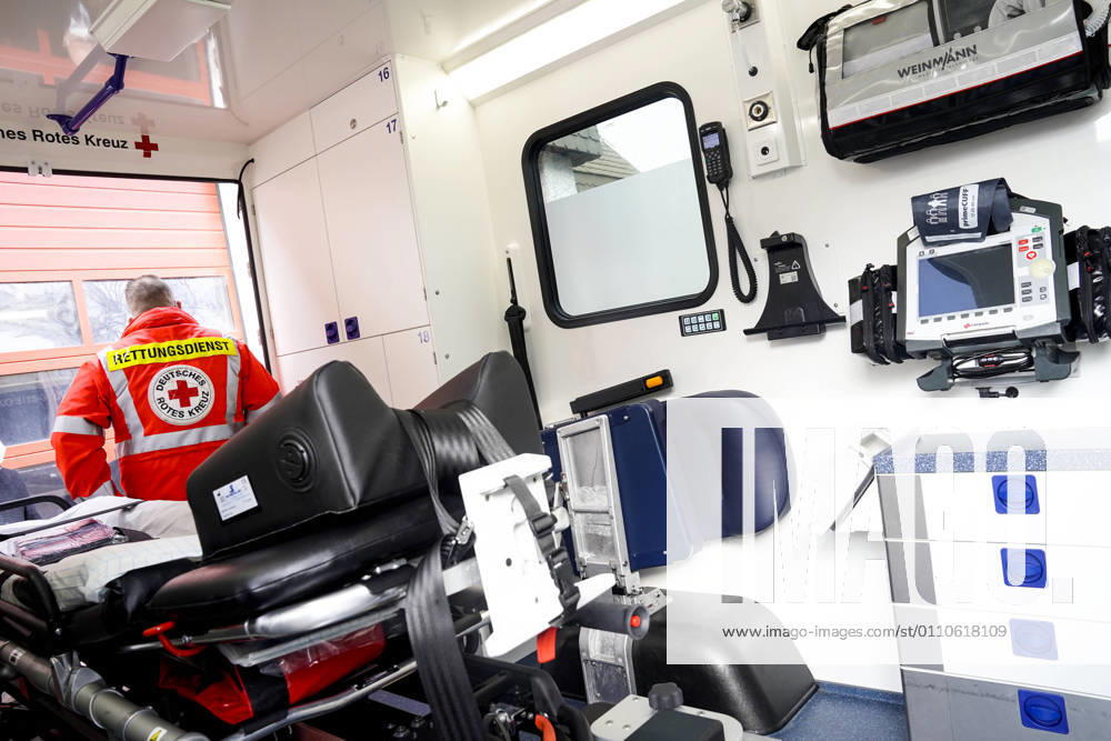 Symbolic picture rescue service, German Red Cross Symbolic picture paramedic with uniform and inscription rescue service in an intensive care transport vehicle ITW of the German Red Cross this is a vehicle of the rescue service to transport intensive care patients in emergency between intensive care units from hospital to hospital Germany
