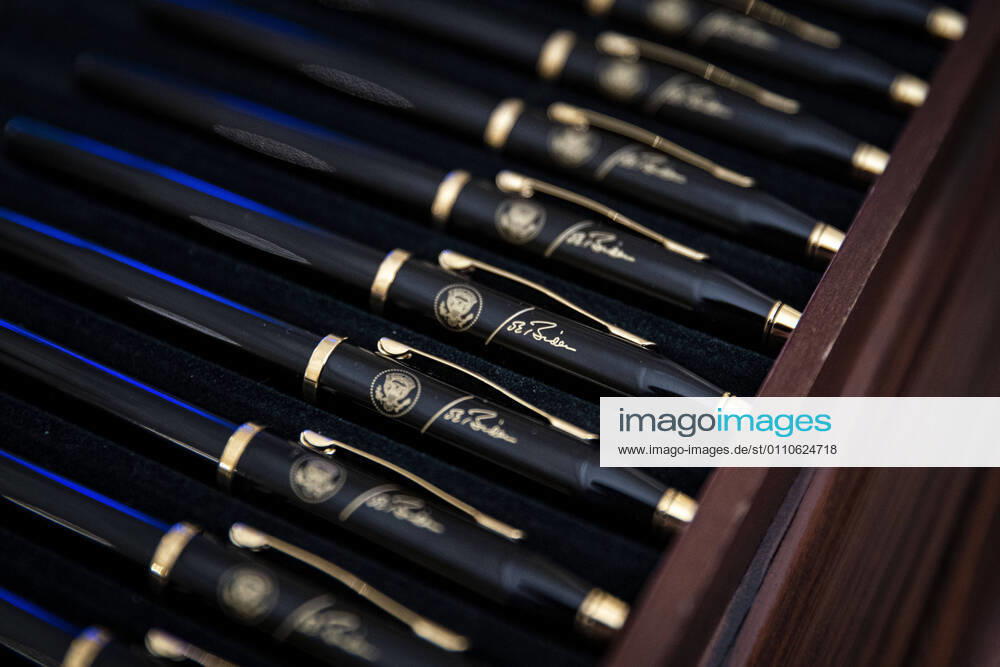 Pens bearing the signature of U.S. President Joe Biden before an event on the Biden administration s Covid-19 response in the State Dining Room of the White House in Washington, D.C., U.S., on Thursday, Jan. 21, 2021. Biden in his first full day in office plans to issue a sweeping set of executive orders to tackle the raging Covid-19 pandemic that will rapidly reverse or refashion many of his predecessor s most heavily criticized policies Washington USA - ZUMAs152 20210121_zaa_s152_167