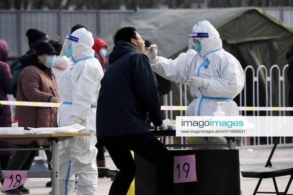 PCR tests in Beijing A person (2nd from R) takes a PCR test in Beijing s Xicheng district on Jan. 22, 2021, amid renewed concerns over the spread of the novel coronavirus.