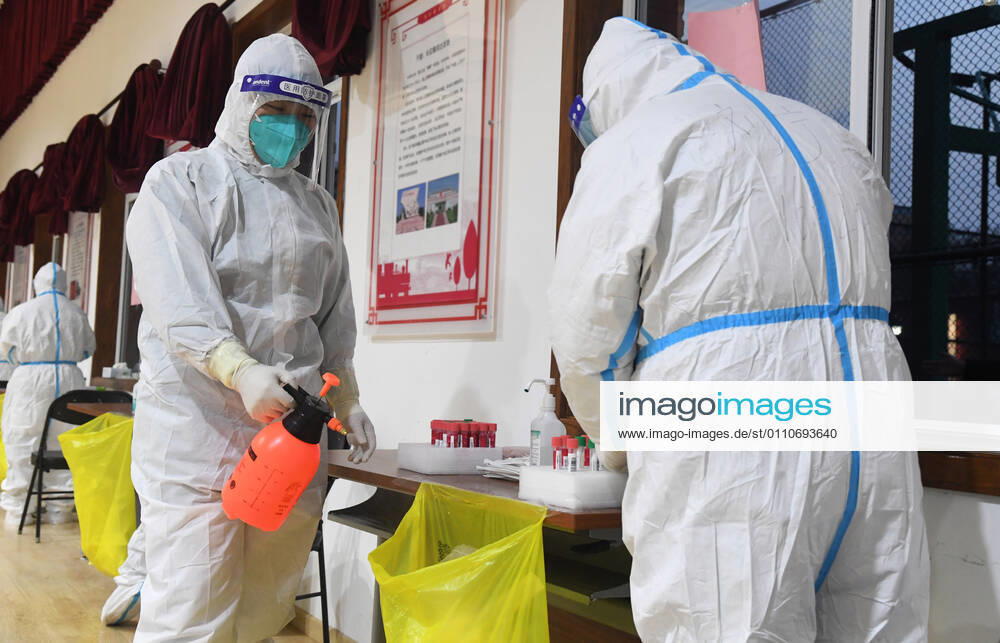 (210122) -- BEIJING, Jan. 22, 2021 -- Medical workers disinfect medical waste at a testing site in Xicheng District, Beijing, capital of China, Jan. 22, 2021. Beijing reported three new locally transmitted confirmed COVID-19 cases, one new locally transmitted asymptomatic infection and two new imported asymptomatic cases on Thursday, the municipal health commission said Friday. All the people living or working in the Dongcheng and Xicheng districts will be undergoing nucleic acid testing for COVID-19 on Friday and Saturday, according to the districts COVID-19 prevention and control work teams. ) CHINA-BEIJING-COVID-19-TEST (CN) RenxChao