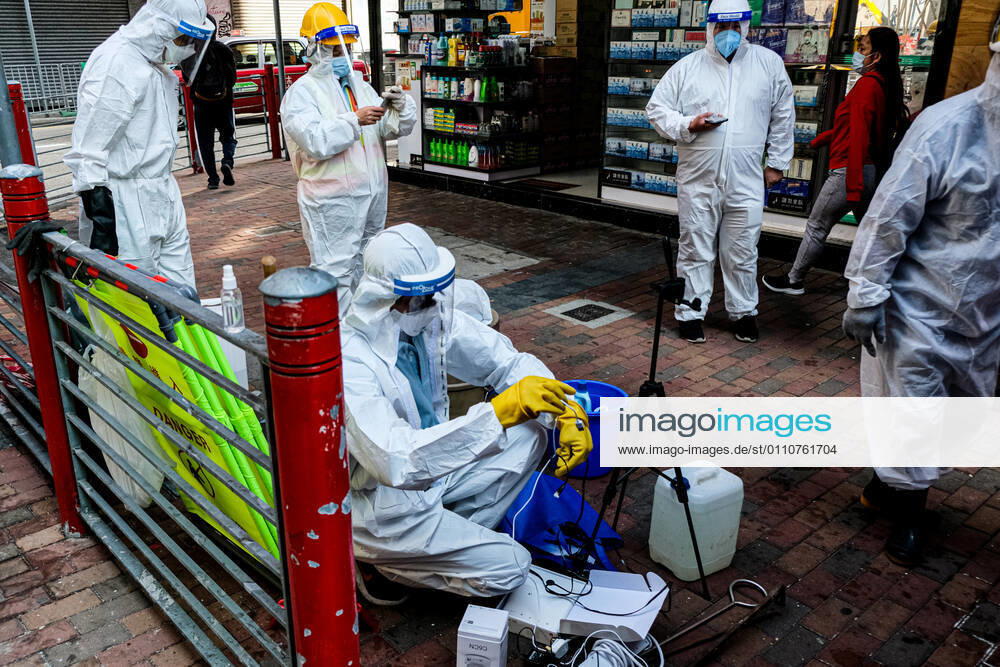 Coronavirus in China, Lockdown in Hongkong January 23, 2021, Hong Kong, China: Government workers wear personal protective equipment examine the sewage system within the lockdown area in Jordon district. Hong Kong government locked down tens of thousand of residents to contain a worsening outbreak of the coronavirus. Hong Kong China - ZUMAt141 20210123_zap_t141_004