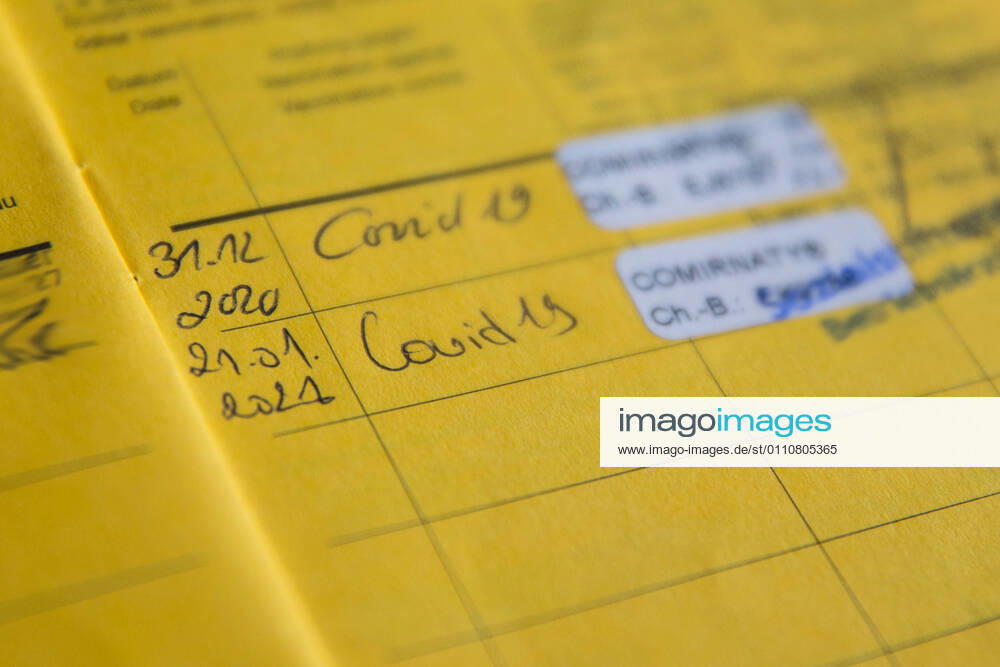Nuremberg, Germany 23 January 2021 A vaccination card lies on a table, in the vaccination book two vaccinations for Covid 19 are registered, thus the person is protected against an infection with the coronavirus Bavaria