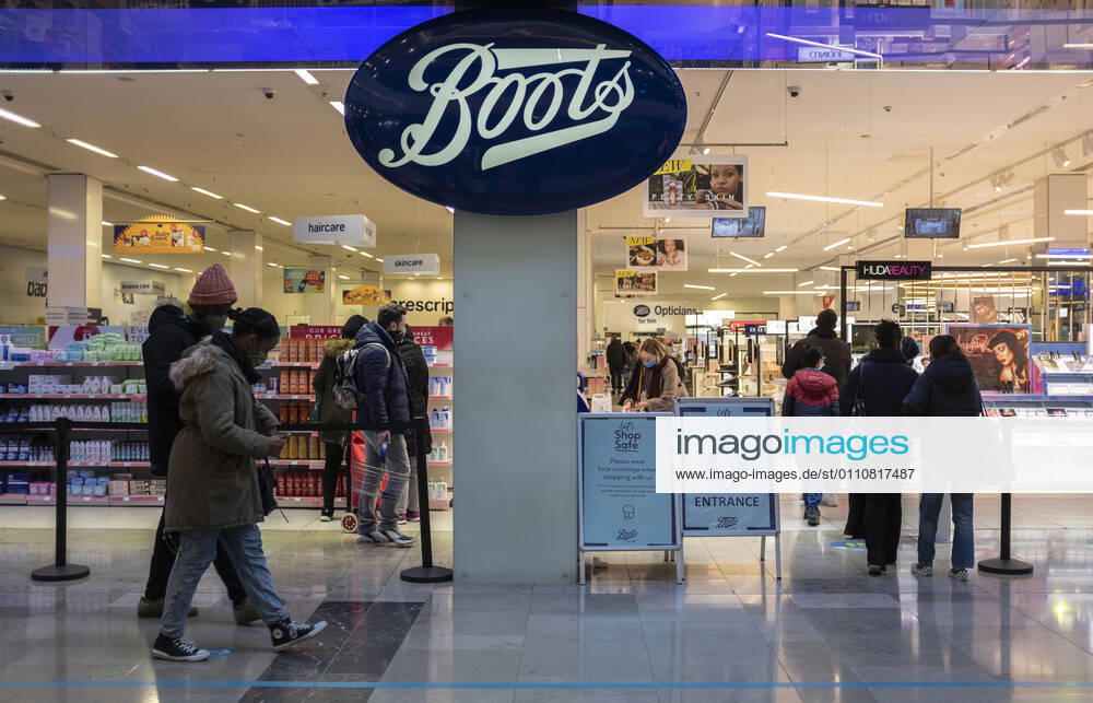 A couple passing Boots, a British health and beauty retailer and pharmacy chain in Stratford, the London Borough of Newham, England, UK on January 23, 2021. Some of England s Covid hotspots are still in London Hounslow, Ealing, Brent, Barking and Dagenham and Newham are the boroughs which fall in the country s top 10 for worst case rates. London United Kingdom - ZUMAj323 20210123_zip_j323_001