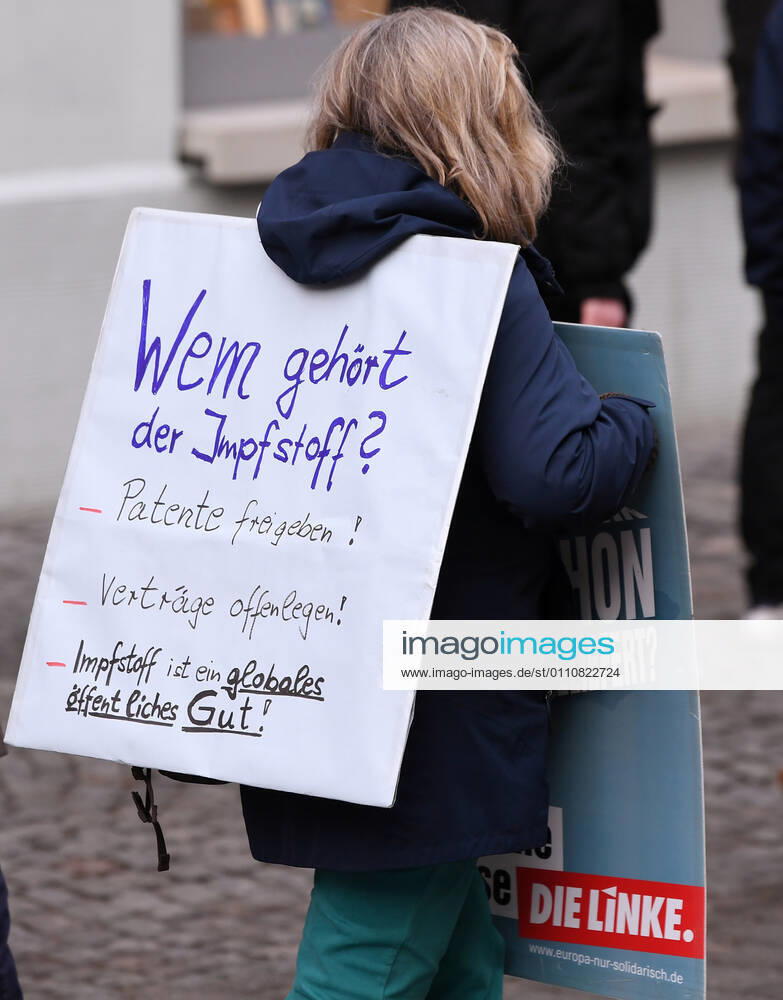 Tuebingen 23 01 2021 Theme picture, demonstrator with banner in Tuebingen city centre Who owns the vaccine Release patents Disclose contracts Vaccine is a global public good ulmer