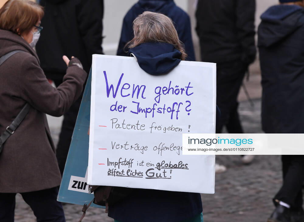 Tuebingen 23 01 2021 Theme picture, demonstrator with banner in Tuebingen city centre Who owns the vaccine Release patents Disclose contracts Vaccine is a global public good ulmer