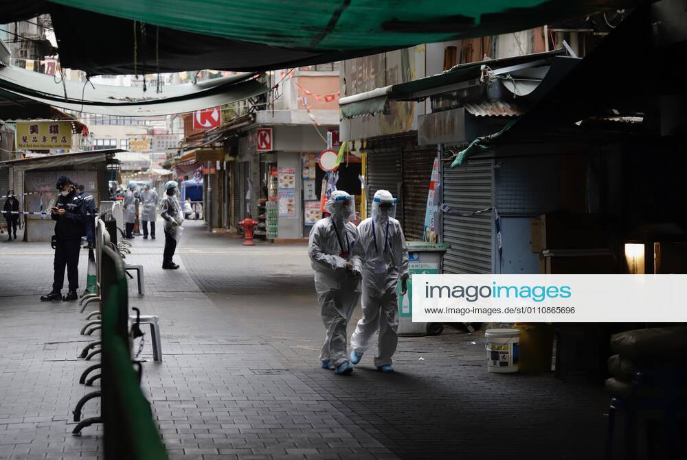 Coronavirus in China, Lockdown in Hongkong January 24, 2021, Hong Kong, CHINA: Government staffs dressed in protective gear walk through designated zone on Temple Street on the 2nd day of lockdown.Jan-24,2021Hong Kong.ZUMA Hong Kong CHINA - ZUMAl137 20210124_zap_l137_002