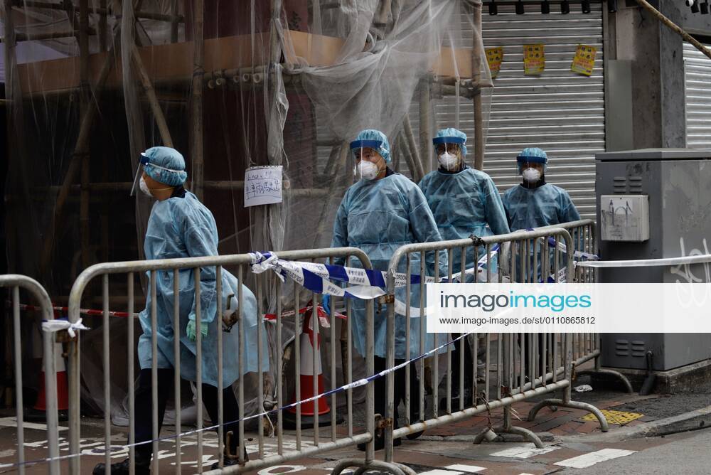 Coronavirus in China, Lockdown in Hongkong January 24, 2021, Hong Kong, CHINA: Government staffs dressed in full protective gear passing through a barricaded Temple Street on the 2nd day of lockdown.Jan-24,2021Hong Kong.ZUMA Hong Kong CHINA - ZUMAl137 20210124_zap_l137_003