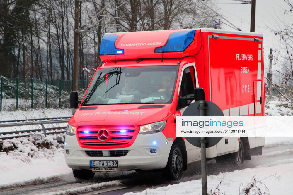Rescue service in the city Rescue service with emergency paramedics of the fire brigade Essen in use during adverse road conditions after snowfall Essen North Rhine Westphalia Germany