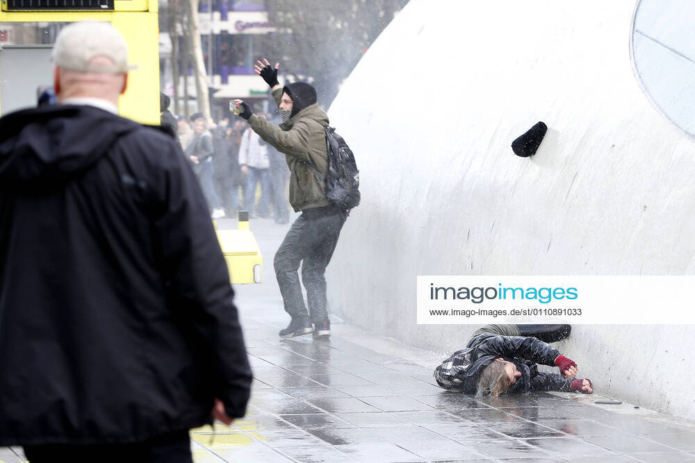 EIDHOVEN, 24-01-2021, 18 Septemberplein, Dutch News, Protests during the dutch lockdown in Eindhoven. Women is being blown away by the water cannon during the protest. Protests in Eindhoven x10564169x