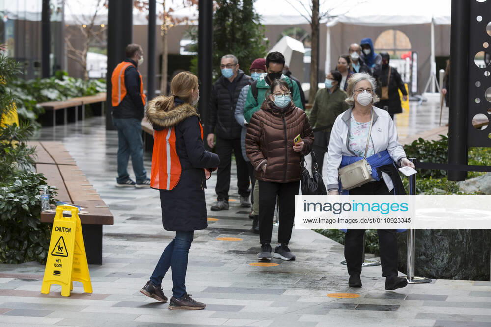 A worker directs patients as they arrive at a pop up COVID-19 vaccine clinic at the Amazon Headquarters in Seattle on Sunday, January 24, 2021. Amazon partnered with Virginia Mason Franciscan Health to vaccinate 2,000 Washingtonians who currently qualify to be vaccinated under the stateÃ¢â‚¬â ¢s COVID-19 Vaccine Phases guidelines. Seattle USA - ZUMAg235 20210124_zap_g235_023