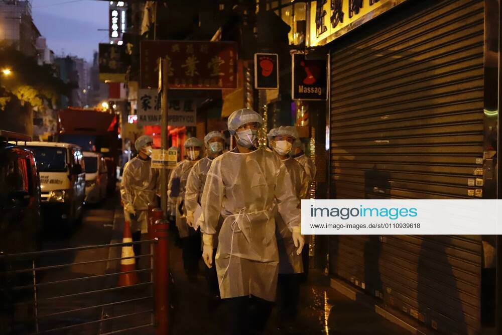 Government staffs in full protective gear are called in for duty early this morning, assigned to check local residents who are released from restricted zone after 48 hours of partial lockdown has been lifted.Jan-25,2021Hong Kong.ZUMA Hong Kong CHINA - ZUMAl137 20210125_zap_l137_001