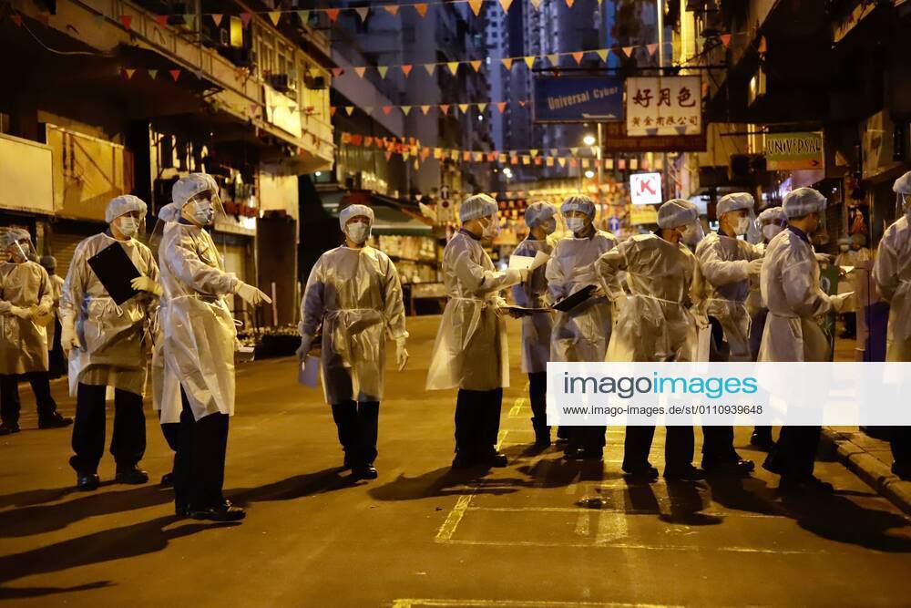 Government staffs are called in for duty in the early morning for checking local residents who are allowed to exit from restricted zone after partial lockdown has been lifted early this morning HK Time.Jan-25,2021Hong Kong.ZUMA Hong Kong CHINA - ZUMAl137 20210125_zap_l137_003