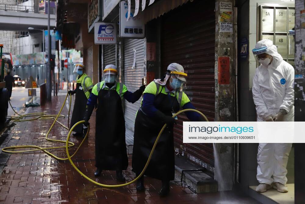 Workers sanitize the pavement on Shanghai Street in Yau Tsim Mong District in the early morning after HK government have lifted partial lockdown which lasted for 48hrs.Jan-25,2021Hong Kong.ZUMA Hong Kong CHINA - ZUMAl137 20210125_zap_l137_006