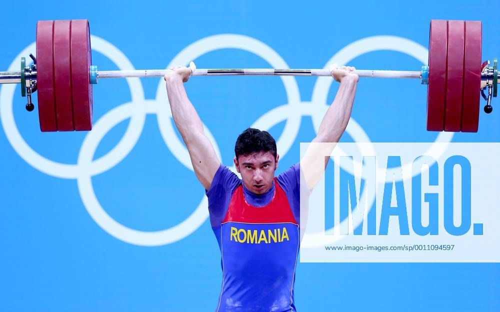 (120731) -- LONDON, July 31, 2012 (Xinhua) -- Razvan Constantin Martin of Romania competes during men s weightlifting 69kg competition at London 2012 Olympic Games in London, Britain, July 31, 2012. Razvan Constantin won bronze medal in this event. (Xinhua Chen Jianli) (zgp) (OLY2012)BRITAIN-LONDON-WEIGHTLIFTING-MEN S 69KG