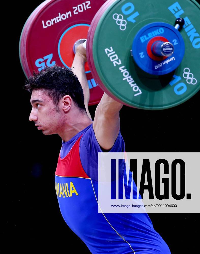 (120731) -- LONDON, July 31, 2012 (Xinhua) -- Razvan Constantin Martin of Romania competes during men s weightlifting 69kg competition at London 2012 Olympic Games in London, Britain, July 31, 2012. Razvan Constantin won bronze medal in this event. (Xinhua Chen Jianli) (zgp) (OLY2012)BRITAIN-LONDON-WEIGHTLIFTING-MEN S 69KG