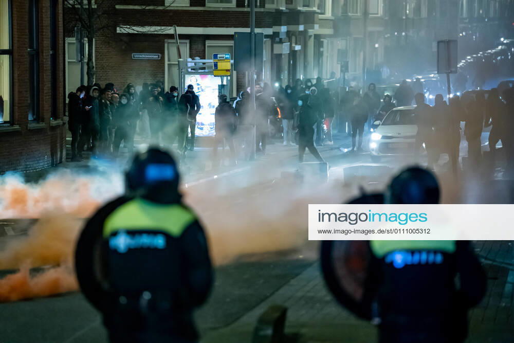 On Beijerlandselaan in South Rotterdam, The Netherlands, a group of about fifty young people has sought confrontation with the police due to the introduction of a curfew as a corona measure, January 25, 2021 The group stands and pelts the police present with stones and fireworks ANP MEDIATV KILLIAN LINDENBURG