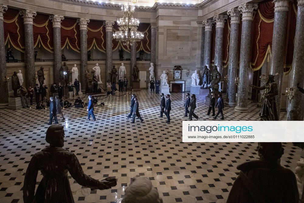 The impeachment managers, led by United States Representative Jamie Raskin (Democrat of Maryland), walk through Statuary Hall to deliver the articles of impeachment against former President Donald Trump to the Senate at the U.S. Capitol in Washington, DC, Monday