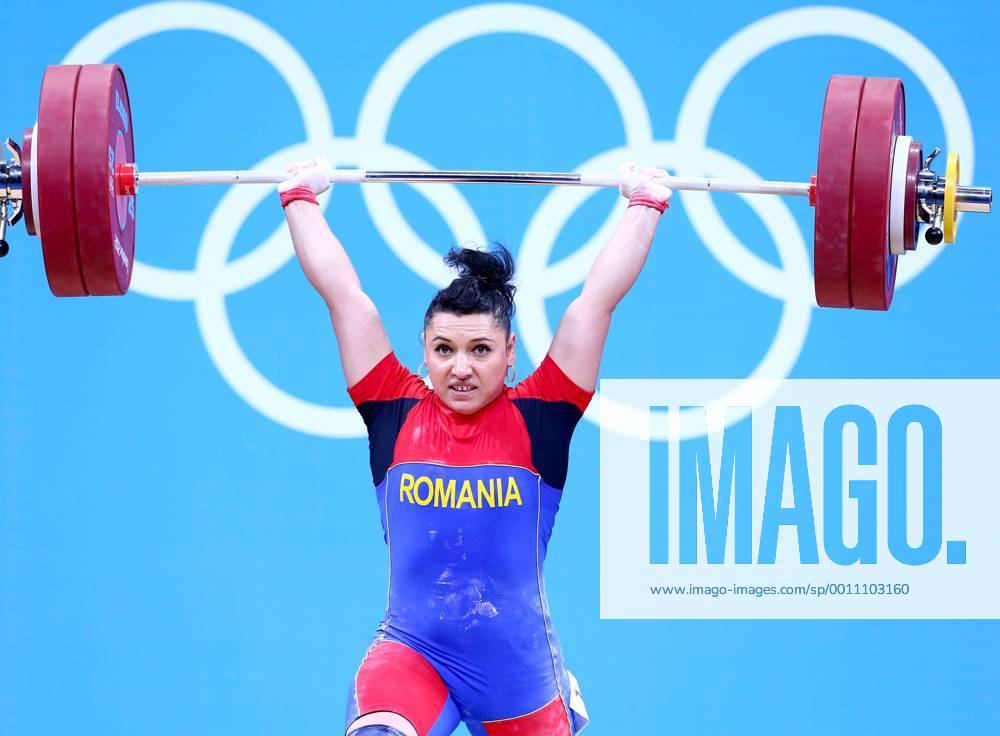(120801) -- LONDON, Aug. 1, 2012 (Xinhua) -- Roxana Daniela Cocos of Romania competes during the women s 69kg weightlifting event at London 2012 Olympic Games, London, Britain, Aug. 1, 2012. Roxana Daniela Cocos won the silver medal of the event with a total of 256kg. (Xinhua Chen Jianli) (OLY2012)BRITAIN-LONDON-WEIGHTLIFTING-WOMEN-69KG