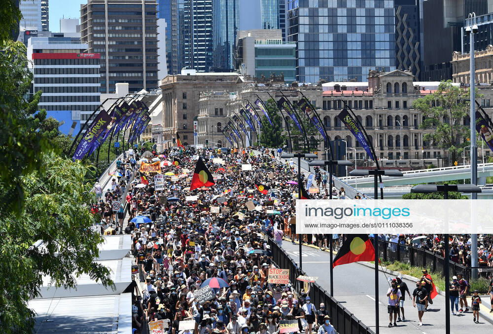 INVASION DAY RALLY BRISBANE, Protestors are seen during an Invasion Day rally in Brisbane, Tuesday, January 26, 2021. Australia Day 2021 has been marked by debates about changing the date or abolishing the holiday, Australia Day honours, and whether rallies should go ahead.( NO ARCHIVING, , NO USE IN BOOKS WITHOUT CONSENT BRISBANE QLD AUSTRALIA