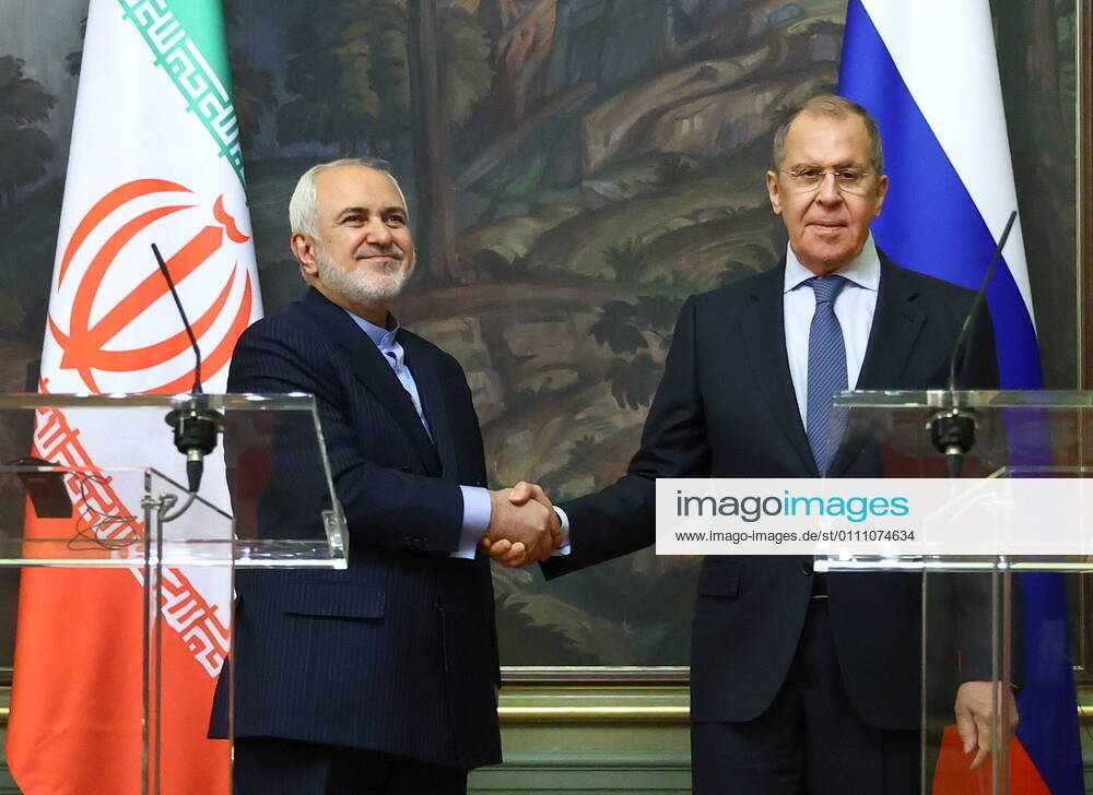 Iran s Foreign Minister Mohammad Javad Zarif (L ) and his Russian counterpart Sergei Lavrov shake hands during a press conference following their meeting at the Reception House. Russian Ministry of Foreign Affairs TASS TS0F5378